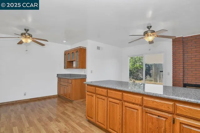 a kitchen with sink cabinets and a granite counter top