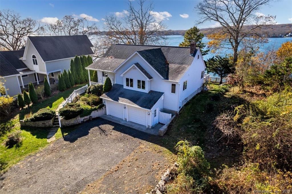 178 Niantic River Road Waterford, CT 06385 - Photo 1 of 1 a front view of a house with a yard garden and outdoor seating