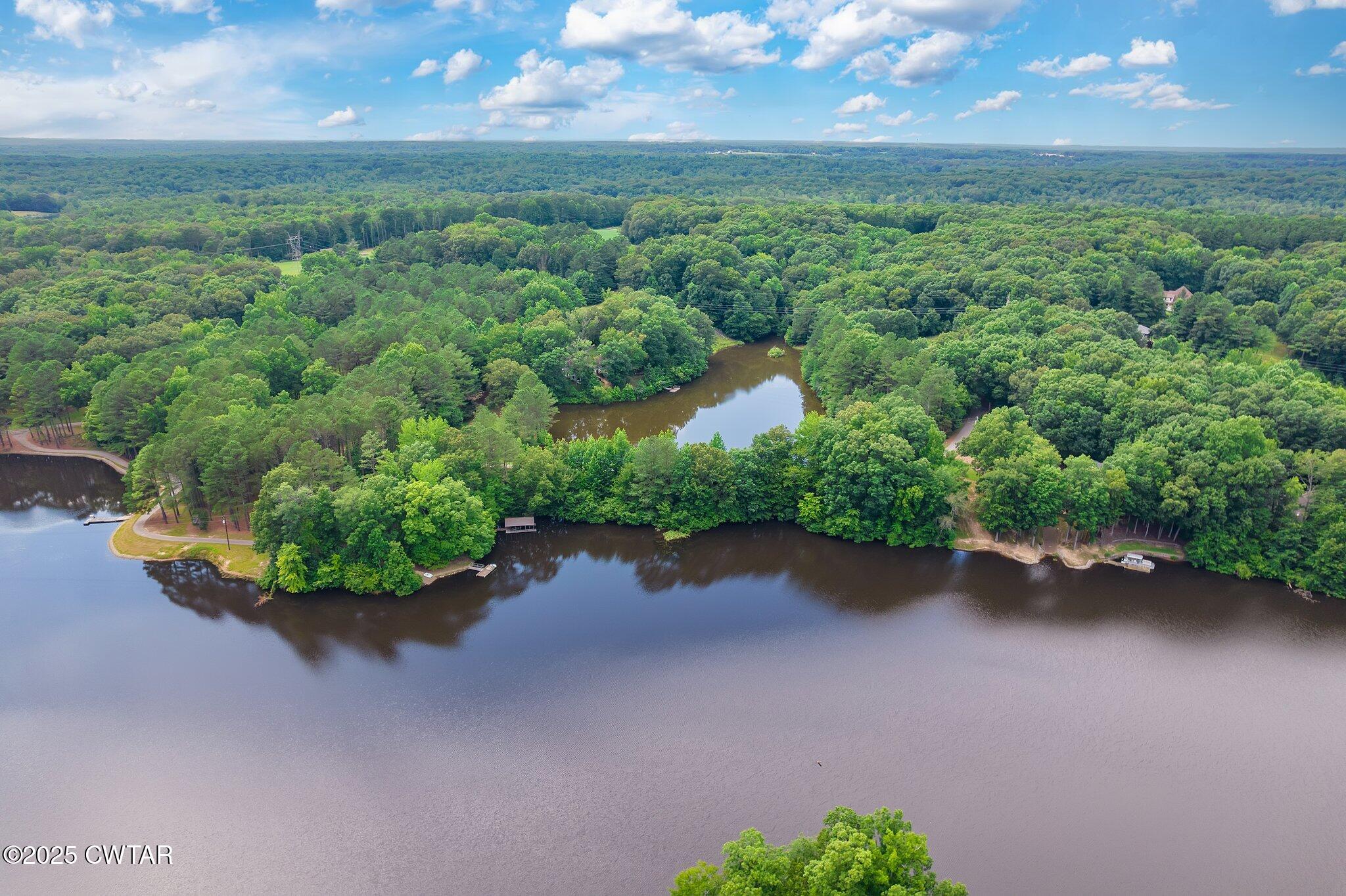 0 Liberty Claybrook Road Beech Bluff, TN 38313 - Photo 2 of 22 an aerial view of a house with a yard and lake view