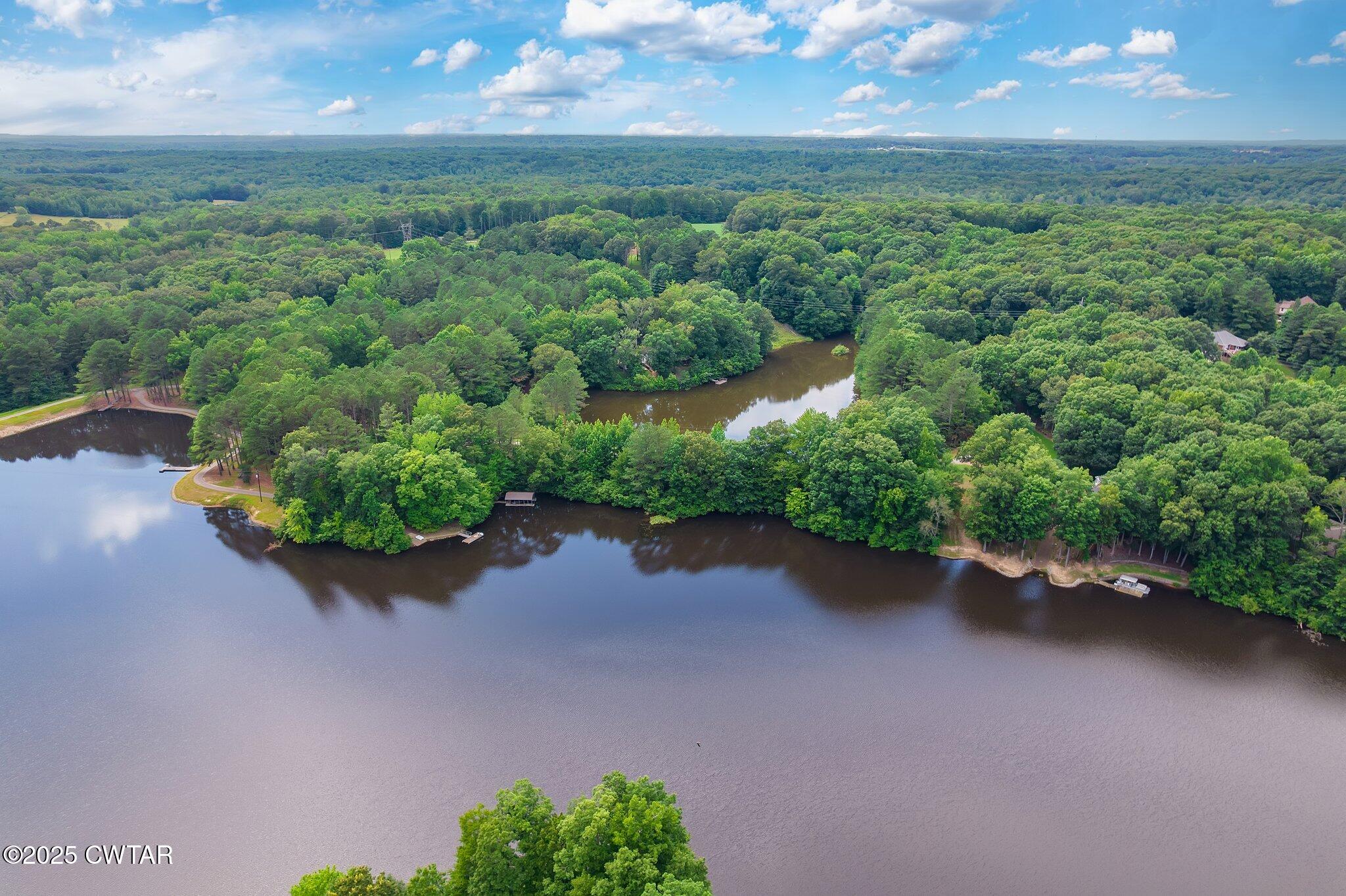 0 Liberty Claybrook Road Beech Bluff, TN 38313 - Photo 21 of 22 an aerial view of a house with a yard and lake view