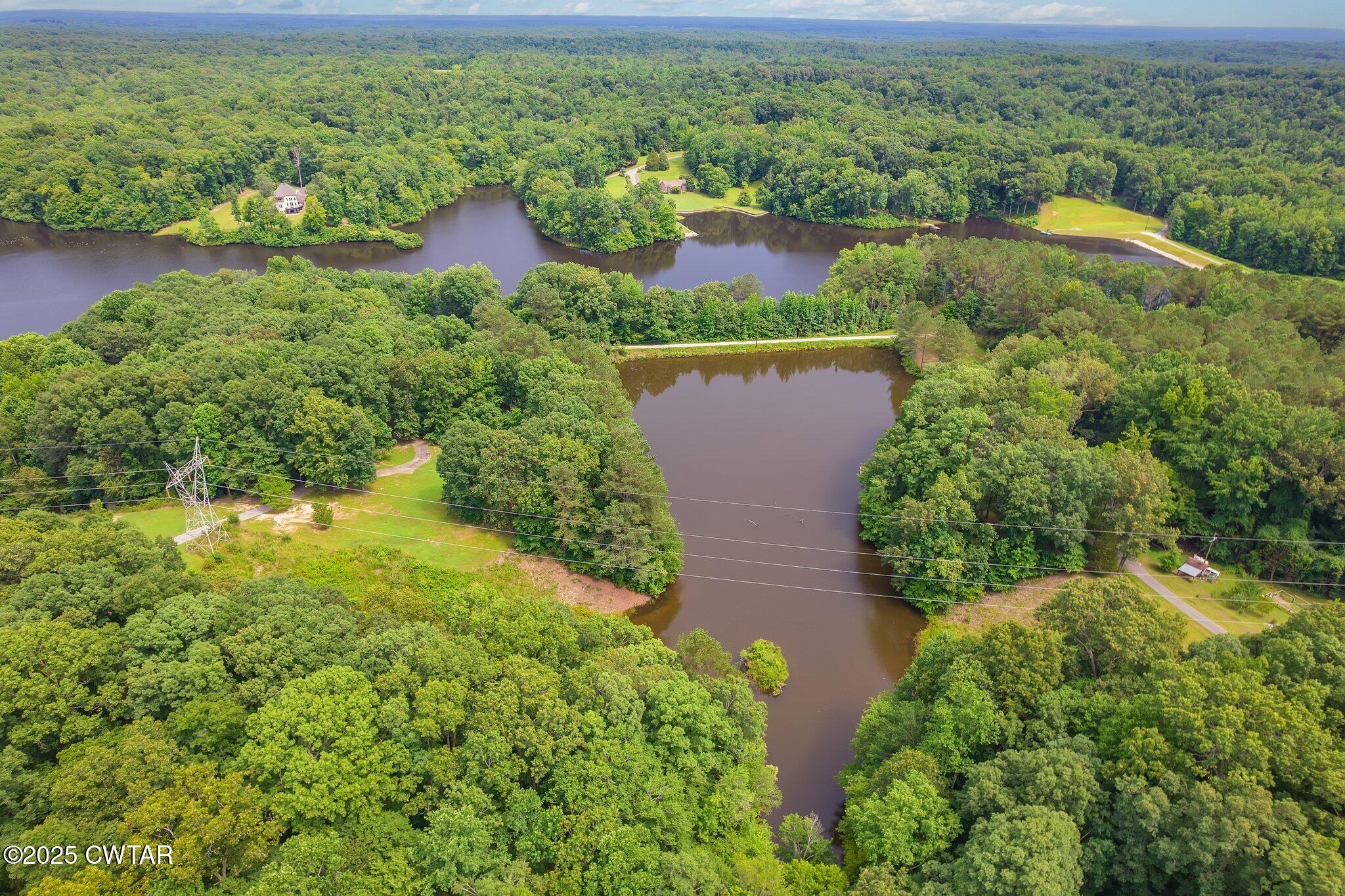 0 Liberty Claybrook Road Beech Bluff, TN 38313 - Photo 7 of 22 an aerial view of residential house with outdoor space and swimming pool