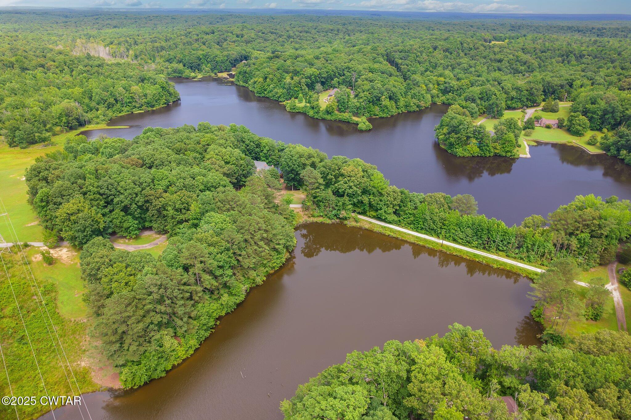 0 Liberty Claybrook Road Beech Bluff, TN 38313 - Photo 10 of 22 an aerial view of a yard with a lake view