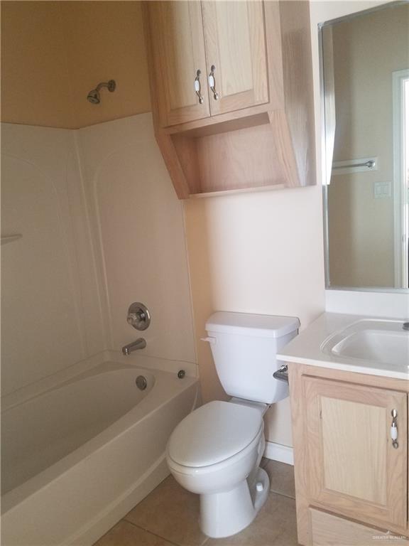 1208 West Wisconsin Road, Unit C Edinburg, TX 78539 - Photo 11 of 16 a bathroom with a toilet a sink and bathtub