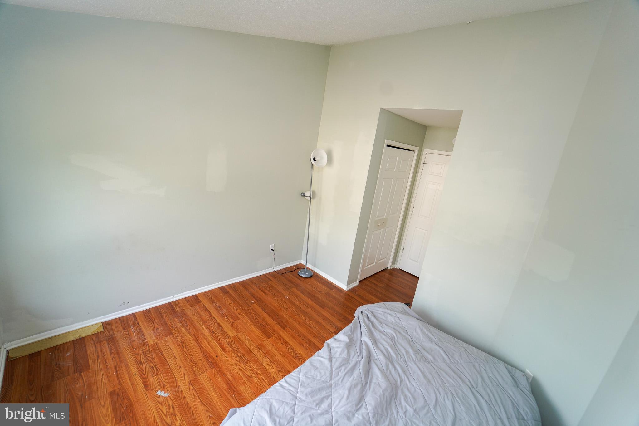 7 Brian Court New Castle, DE 19720 - Photo 13 of 17 a bedroom with a bed and wooden floor