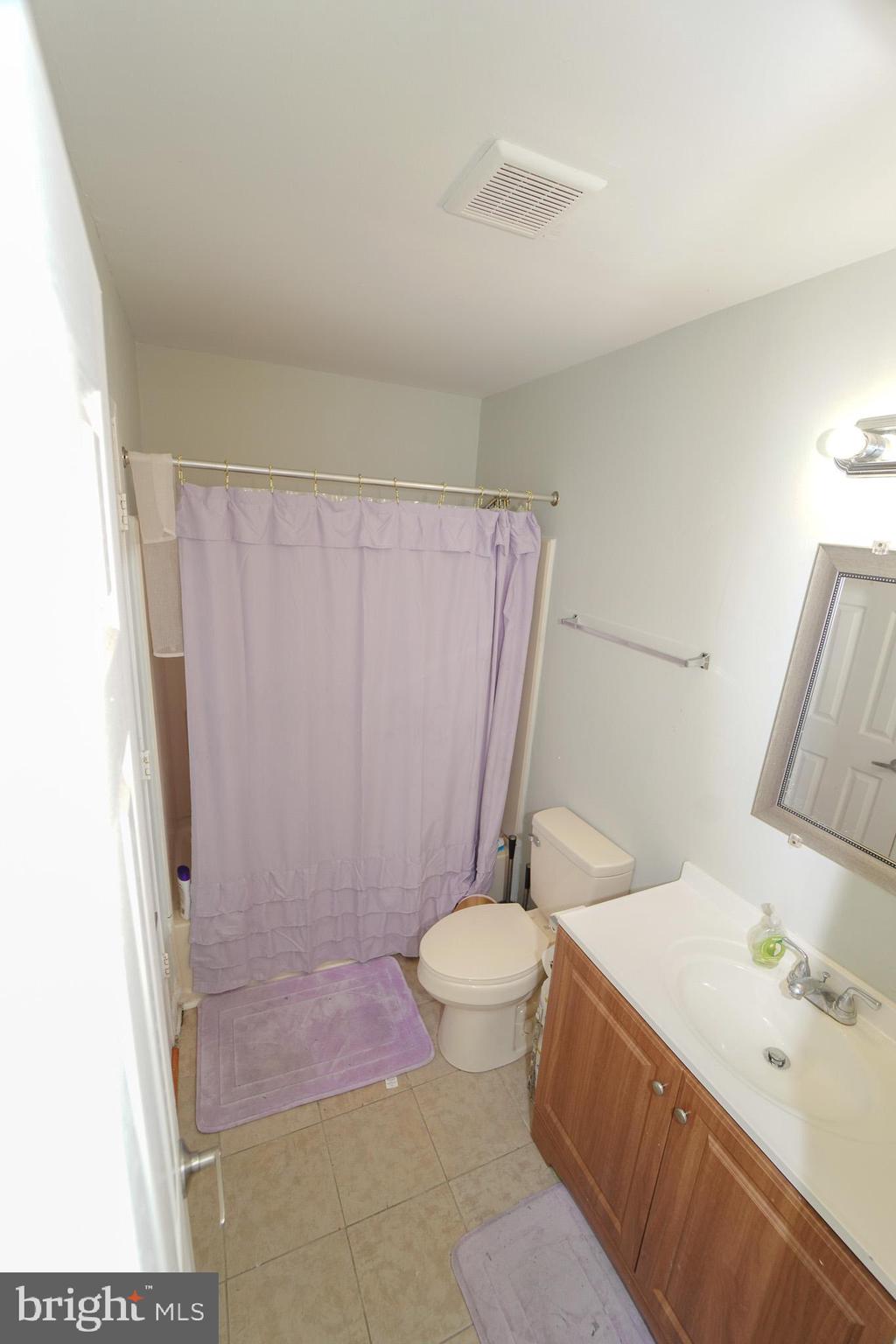 7 Brian Court New Castle, DE 19720 - Photo 14 of 17 a bathroom with a sink a toilet and shower