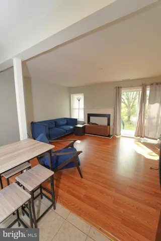 a kitchen with granite countertop a refrigerator stove top oven and sink