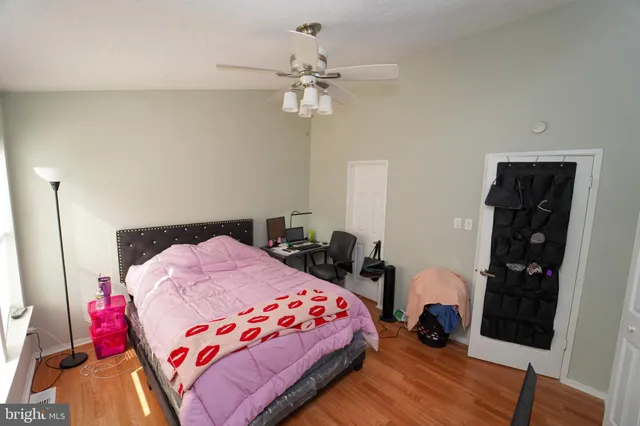 a bedroom with two beds and a window