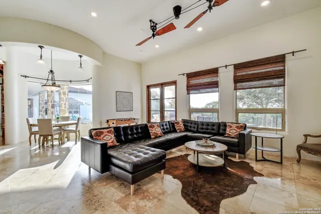 a view of a livingroom with furniture and a potted plant