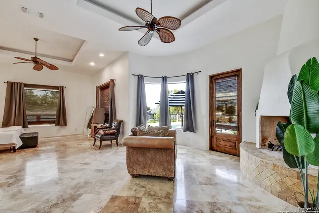 a spacious bedroom with a bed and a painting on the wall