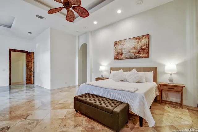 a bathroom with a sink a mirror and a window