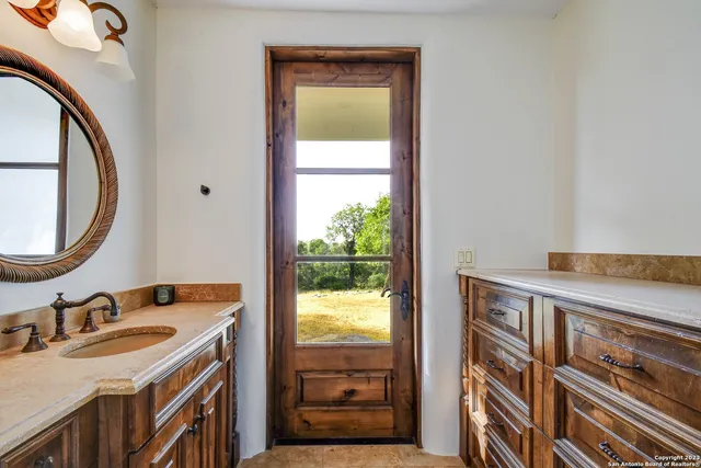 a bathroom with a sink and vanity