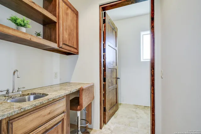 a bathroom with a sink a mirror and a shower