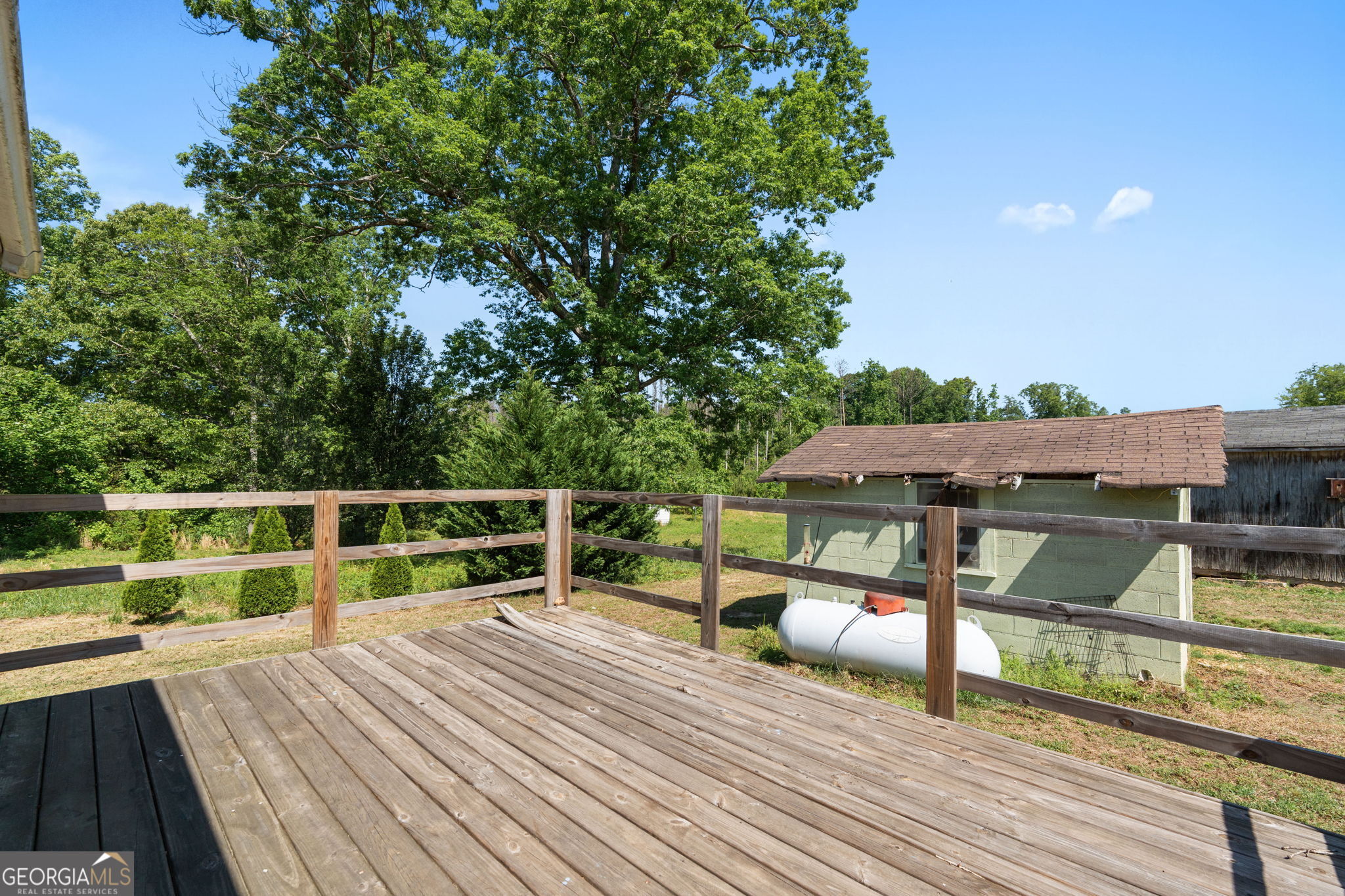 49 Frost Road Bowdon, GA 30108 - Photo 32 of 60 a view of house with deck and outdoor space
