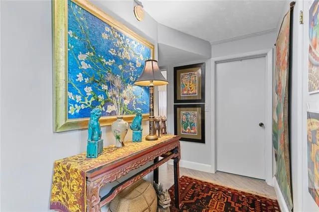 a bathroom with a granite countertop sink mirror and toilet