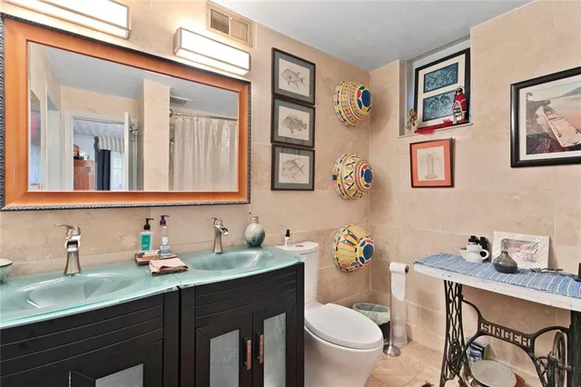 a bedroom with a bed and flat screen tv