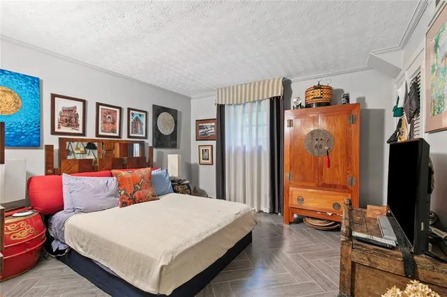 a bedroom with a bed and a cabinets