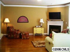 17605 Calverton Road Huntersville, NC 28078 - Photo 5 of 8 a living room with furniture fireplace and flat screen tv