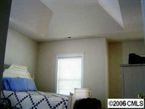 17605 Calverton Road Huntersville, NC 28078 - Photo 6 of 8 a bedroom with a bed and a window