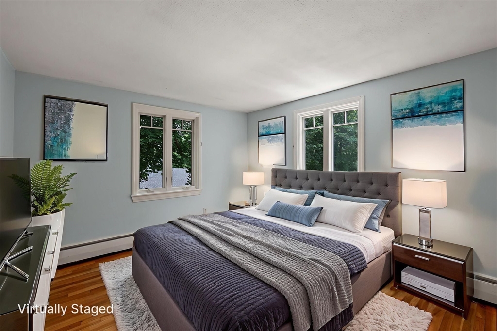 7 Ratlin Road Marblehead, MA 01945 - Photo 16 of 23 a bedroom with a bed and wooden floor