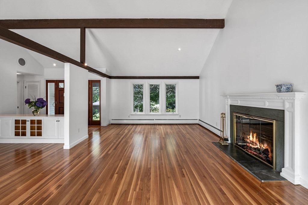 7 Ratlin Road Marblehead, MA 01945 - Photo 7 of 23 a view of an empty room with wooden floor fireplace and a window