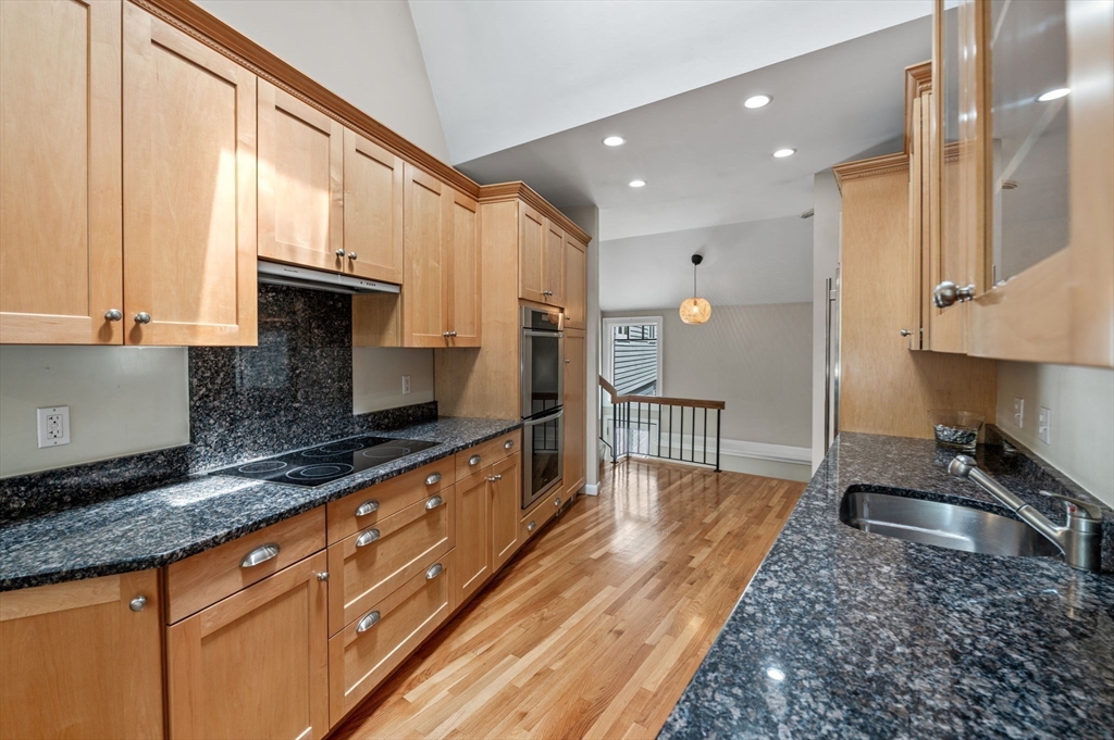 7 Ratlin Road Marblehead, MA 01945 - Photo 9 of 23 a large kitchen with granite countertop a large counter top a sink stainless steel appliances and cabinets