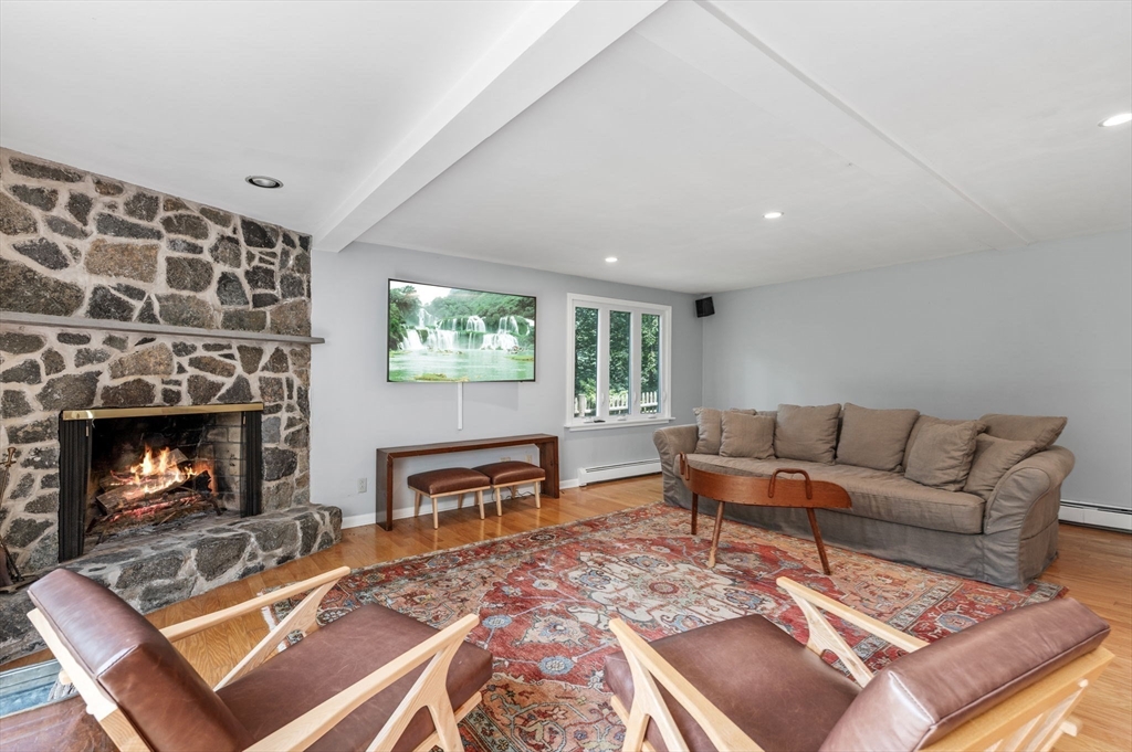 7 Ratlin Road Marblehead, MA 01945 - Photo 10 of 23 a living room with furniture and a fireplace