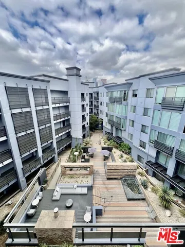 a view of balcony with furniture