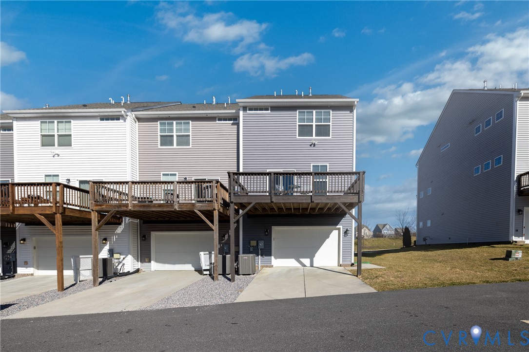 6418 Cassia Loop Moseley, VA 23120 - Photo 33 of 38 Rear view of house featuring driveway, a deck, an