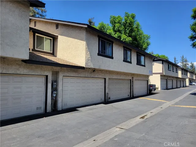 a front view of a house with a garage