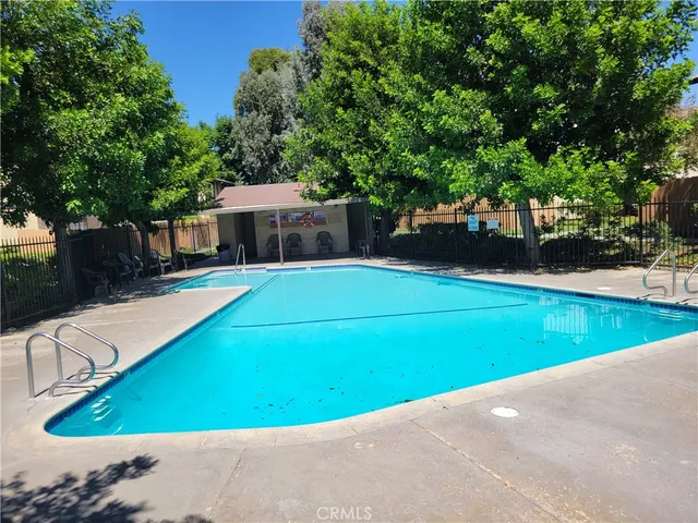 a view of a swimming pool with a patio