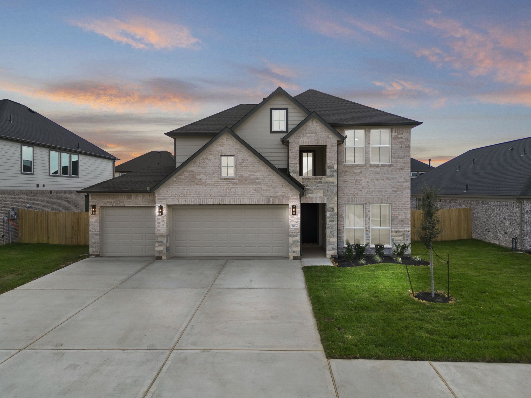 front view of a house with a yard
