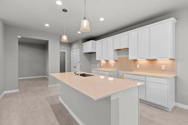 a view of a kitchen with furniture and a chandelier