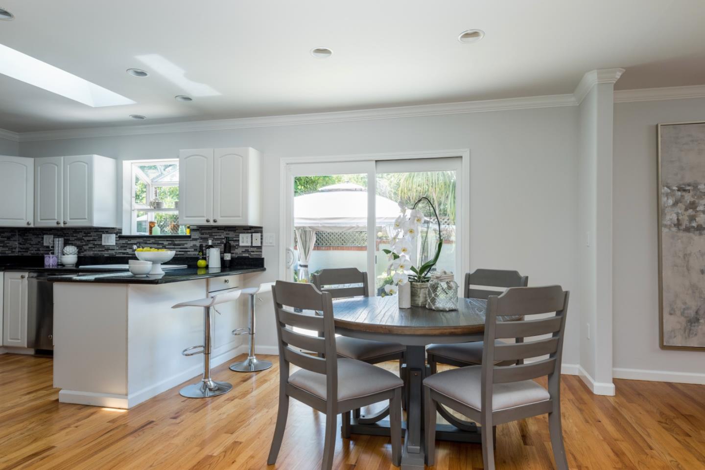 230 Springer Road Los Altos, CA 94024 - Photo 8 of 28 a view of a dining room with furniture window and wooden floor