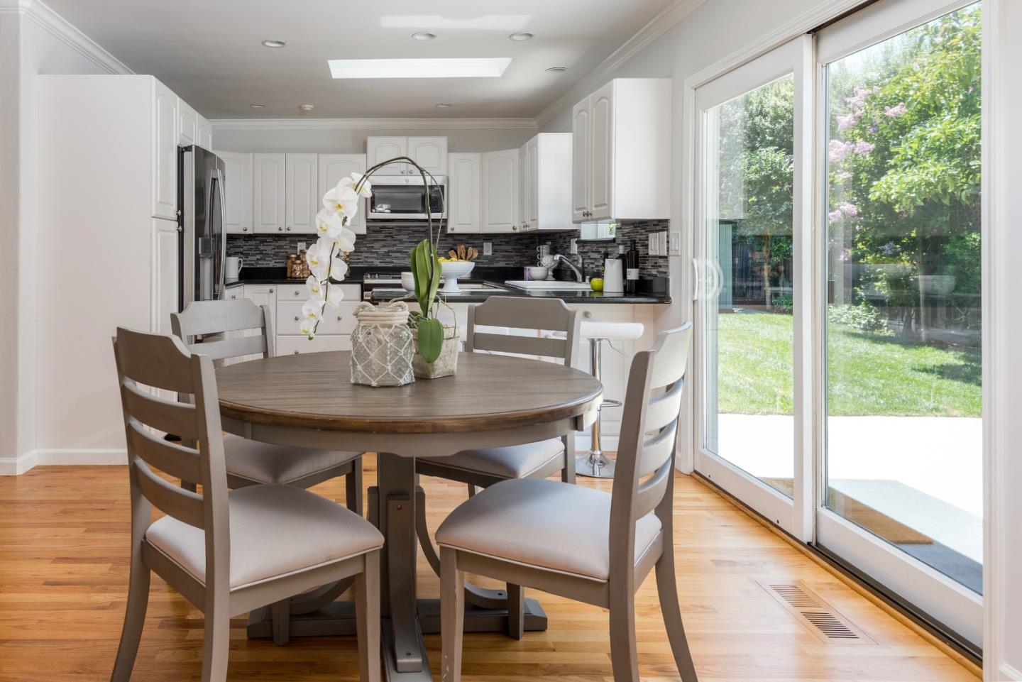 230 Springer Road Los Altos, CA 94024 - Photo 9 of 28 a view of a dining room with furniture window and outside view