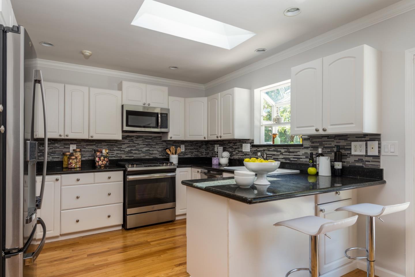 230 Springer Road Los Altos, CA 94024 - Photo 10 of 28 a kitchen with sink a stove and cabinets