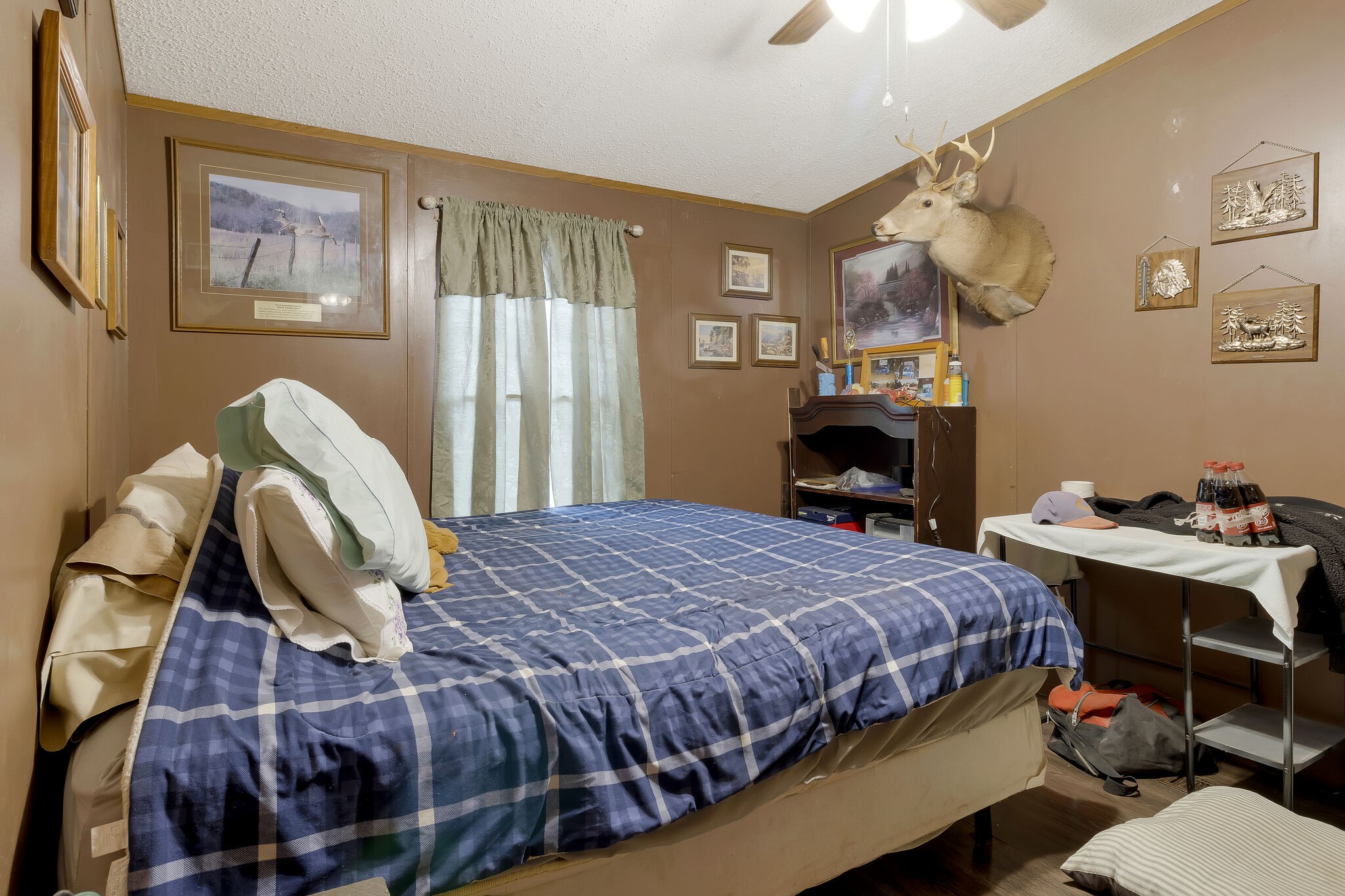 3209 Manley Drive Centerville, TN 37033 - Photo 16 of 23 a bedroom with a bed window and wall painting
