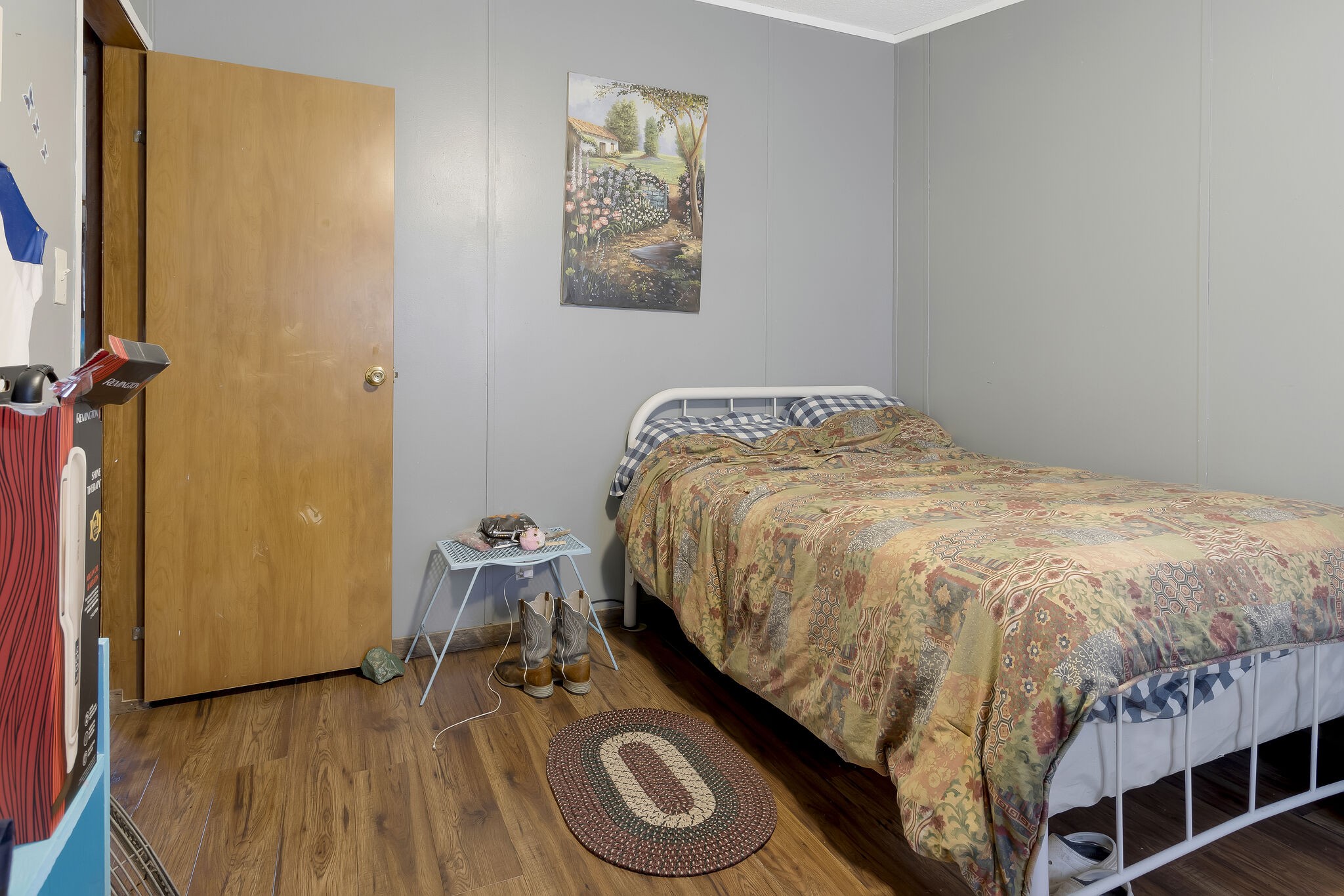 3209 Manley Drive Centerville, TN 37033 - Photo 17 of 23 a bedroom with a bed and wooden floor