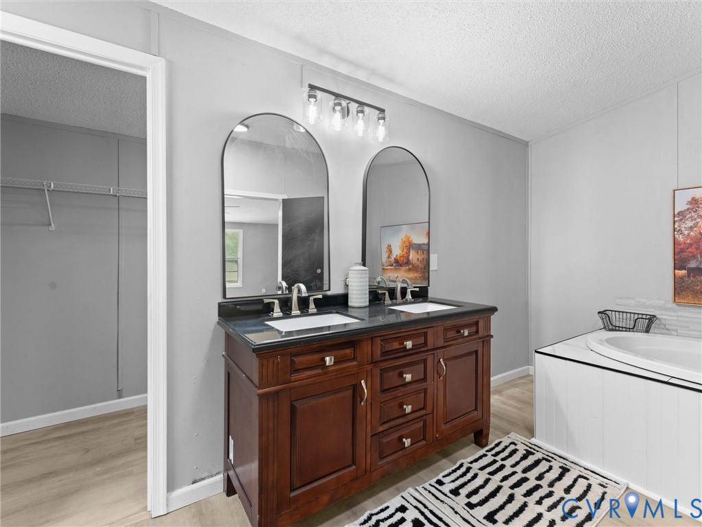 1909 Neves Road Beaverdam, VA 23015 - Photo 30 of 48 Dual vanity with a dark wood finish and dark count