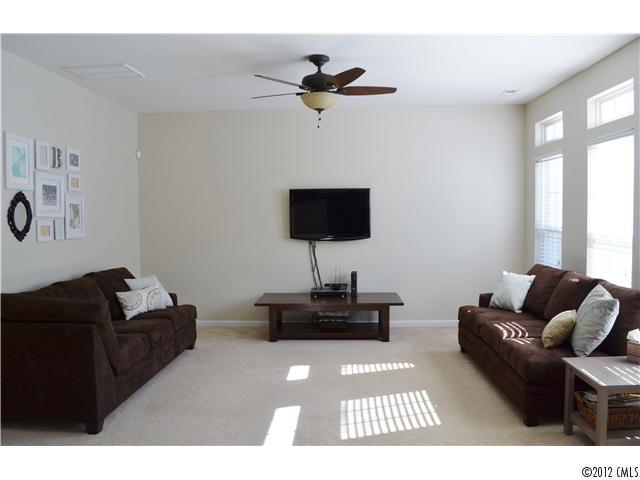 190 Snead Road, Unit 190 Fort Mill, SC 29715 - Photo 8 of 16 a living room with furniture and a flat screen tv