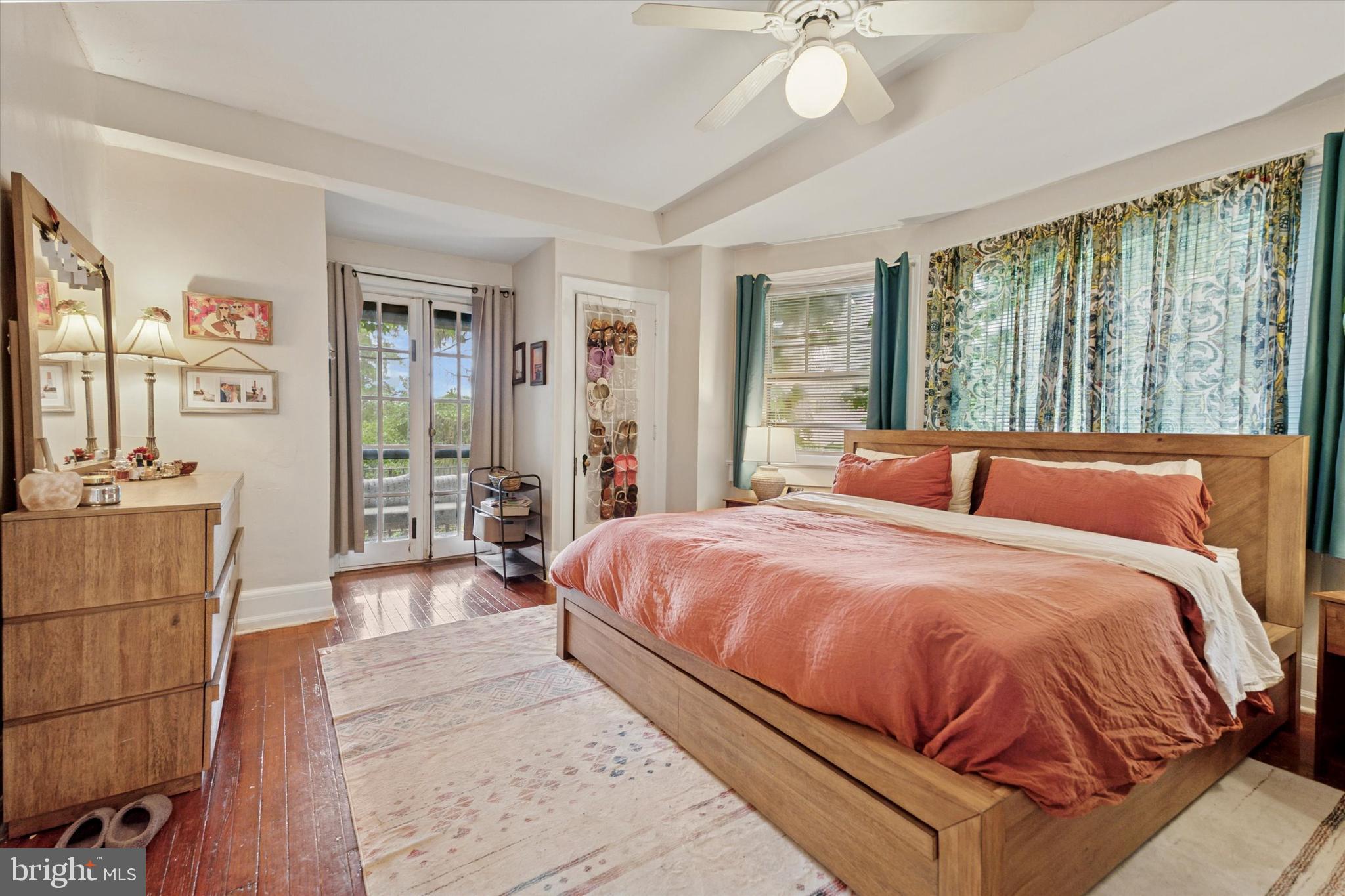 2814 Midvale Avenue Philadelphia, PA 19129 - Photo 11 of 25 a bedroom with a large bed and a chandelier