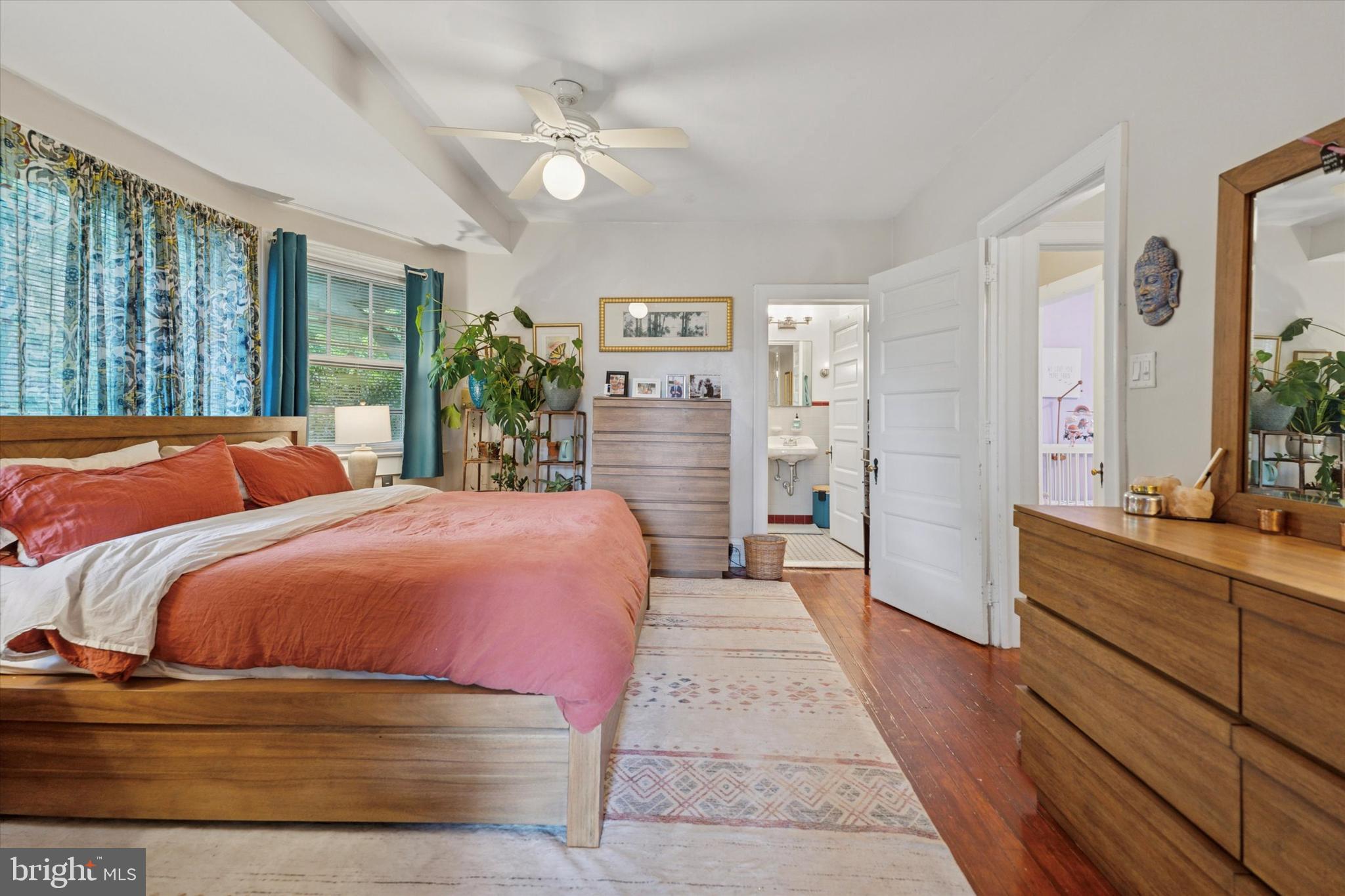 2814 Midvale Avenue Philadelphia, PA 19129 - Photo 12 of 25 a bedroom with a large bed and a chandelier