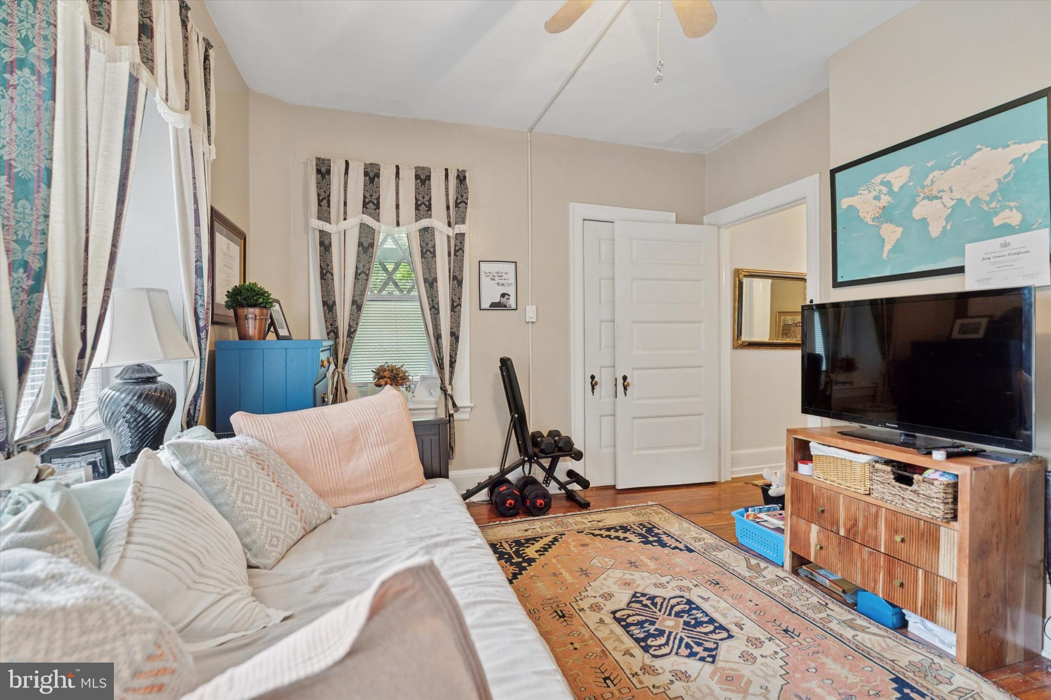 2814 Midvale Avenue Philadelphia, PA 19129 - Photo 17 of 25 a living room with furniture and a flat screen tv