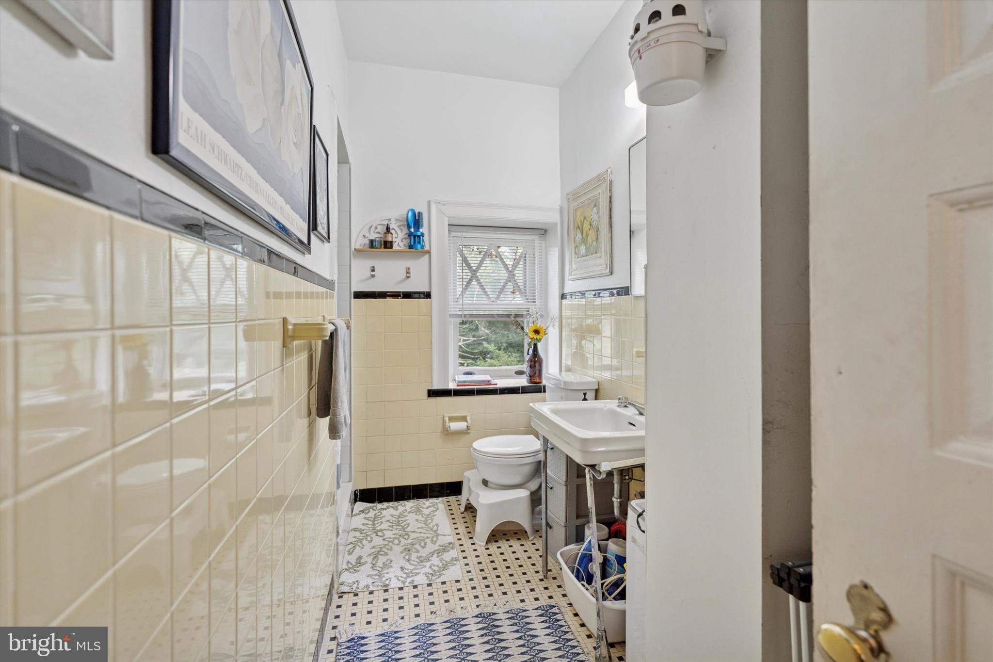 2814 Midvale Avenue Philadelphia, PA 19129 - Photo 18 of 25 a bathroom with a sink a toilet a window and shower