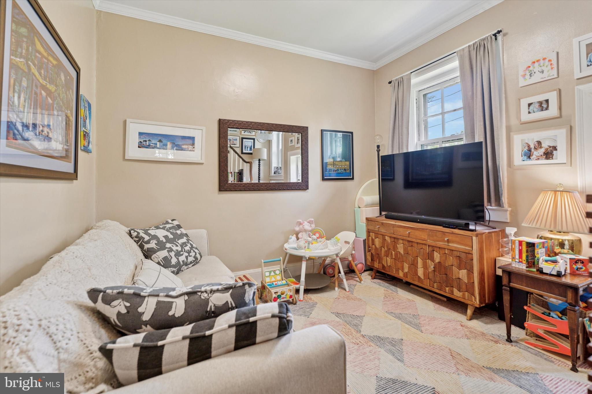 2814 Midvale Avenue Philadelphia, PA 19129 - Photo 7 of 25 a living room with furniture and a flat screen tv