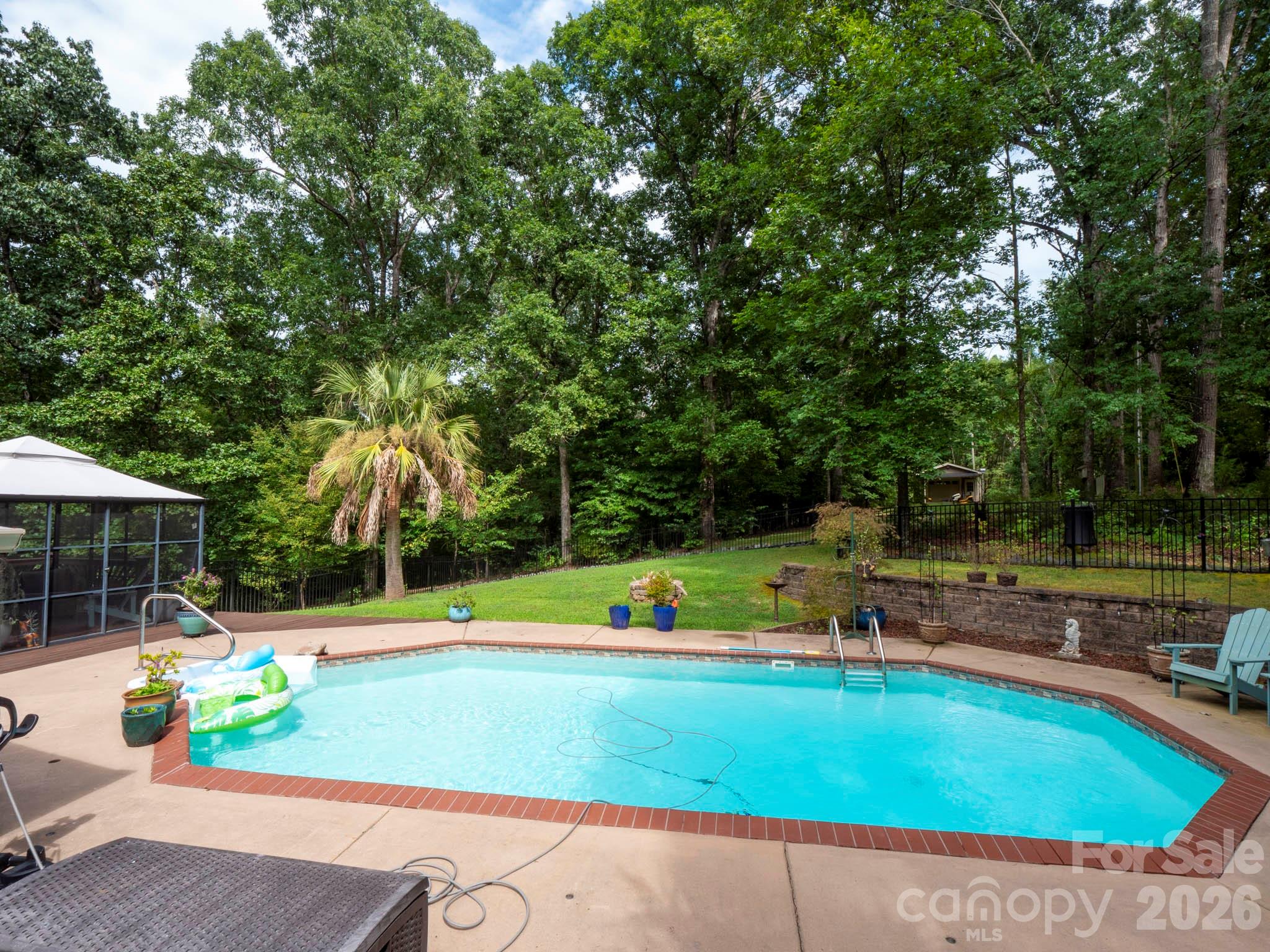 8720 Unionville-Brief Road Monroe, NC 28110 - Photo 18 of 35 a view of a swimming pool with a patio