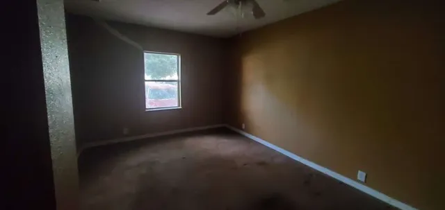 a view of empty room with windows