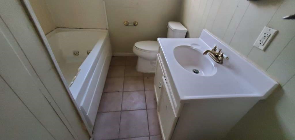 6136 25th Street Groves, TX 77619 - Photo 17 of 20 a bathroom with a sink and toilet