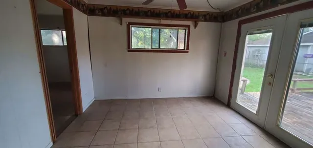 a view of an empty room with a window