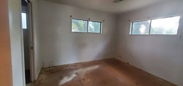 an empty room with windows