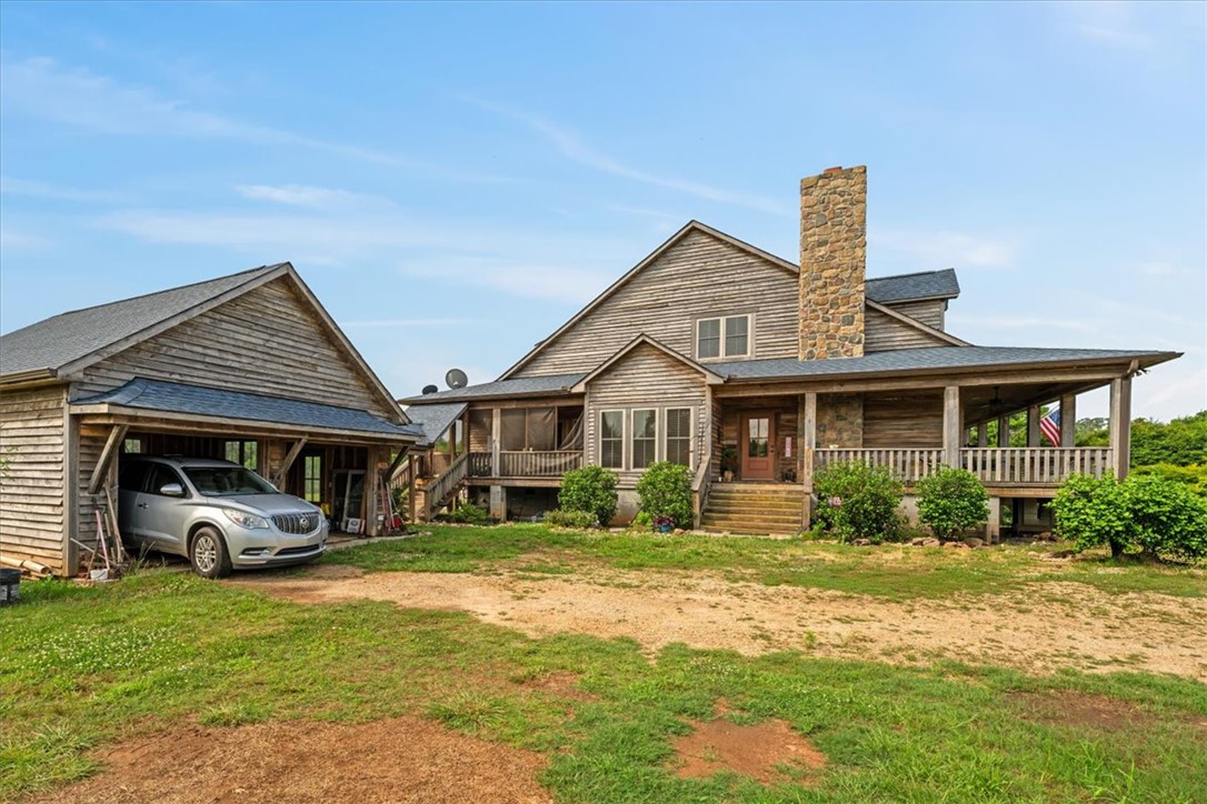 100 Princeton Highway Honea Path, SC 29654 - Photo 5 of 50 Side entrance; Detached garage & breezeway to side screened porch